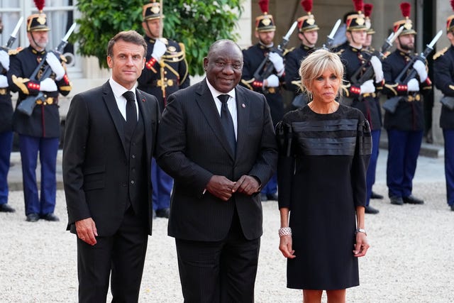 French President Emmanuel Macron and his wife Brigitte welcome Cyril Ramaphosa, centre, before dinner at the Elysee Palace in Paris earlier this month