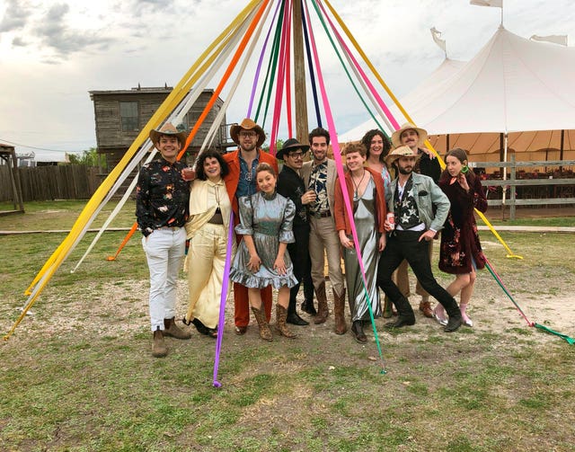 Guests who adhered to the dress code of 'Space Disco Cowboy' at a wedding in Austin, Texas 