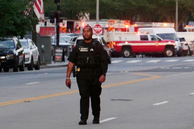 A Secret Service officer stands outside the White House