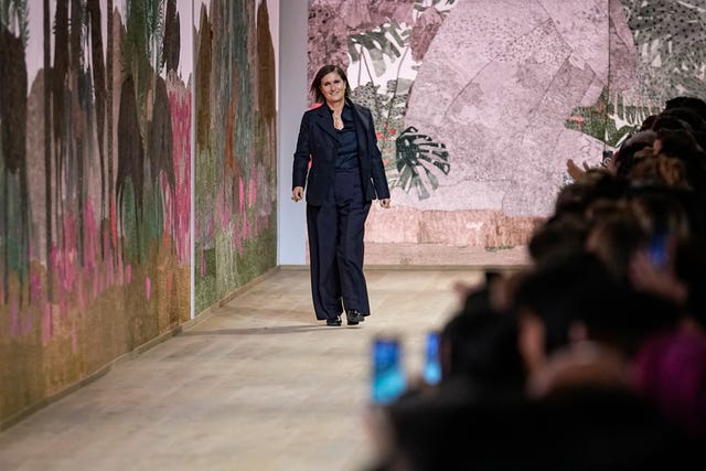 Maria Grazia Chiuri takes a bow at the end of the show