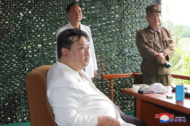 North Korean leader Kim Jong Un watches what North Korea says is the test-firing of an Hwasong-18 ICBM, at an undisclosed location, in North Korea