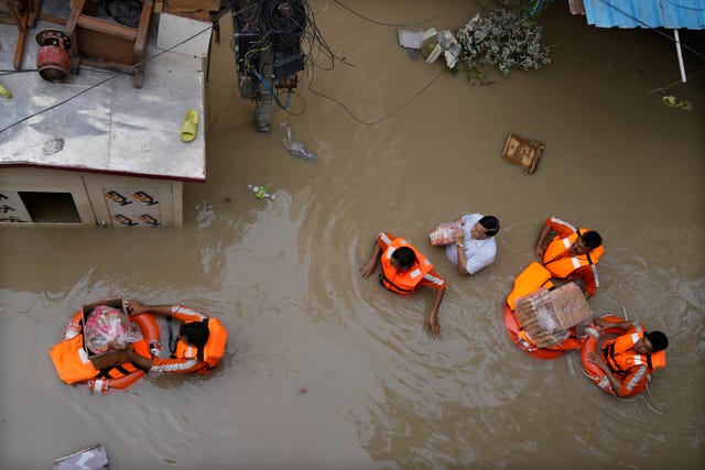 Rescue workers in flood waters