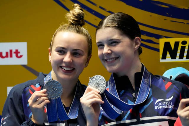 Andrea Spendolini-Sirieix and Lois Toulson of Great Britain celebrate with their silver medals in the women’s synchronized 10m platform diving final at the World Swimming Championships in Fukuoka, Japan
