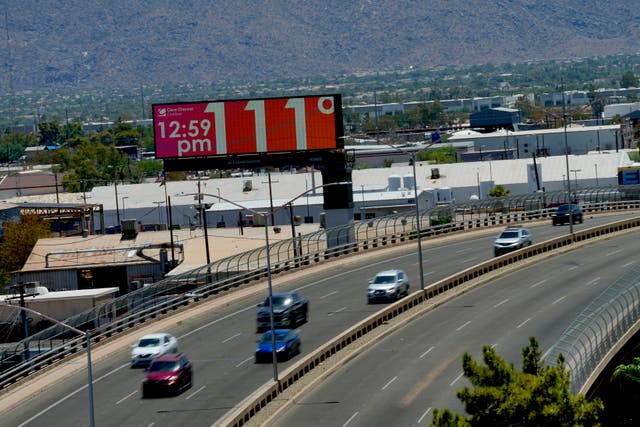 A digital billboard displays an unofficial temperature on Monday in central Phoenix