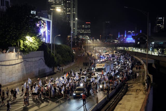Demonstrators in Tel Aviv block traffic on a motorway crossing the city during a protest against plans by Benjamin Netanyahu’s government to overhaul the judicial system
