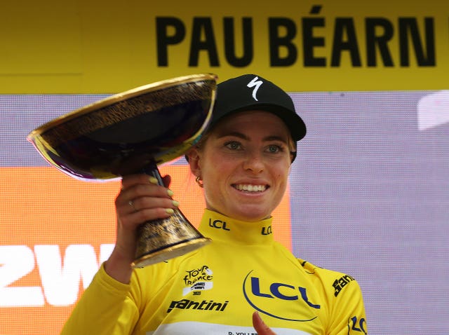 Demi Vollering holds her trophy after winning the Tour de France Femmes in Pau