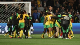 Jamaica’s players celebrate after holding Brazil to reach the World Cup knockout stage for the first time (Hamish Blair/AP)