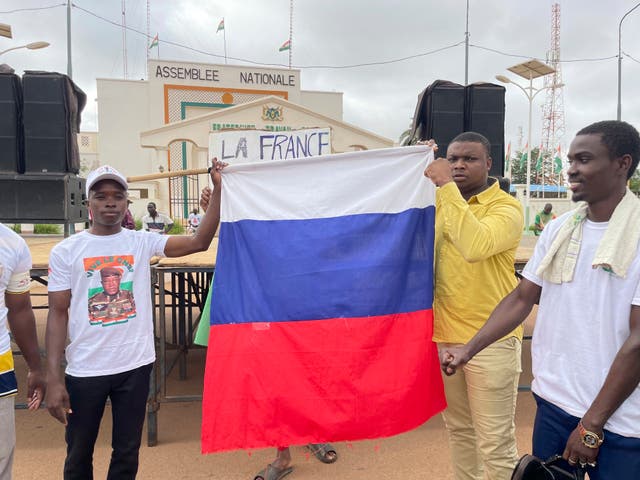 Supporters or Niger’s ruling junta hold a Russian flag at the start of a protest called to fight for the country’s freedom and push back against foreign interference in Niamey, Niger, on Thursday 