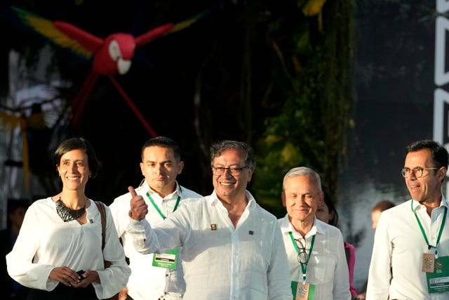 Colombia’s President Gustavo Petro gives a thumbs up as he departs the summit in Belem, Brazil