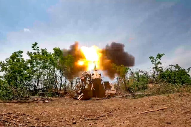 A Russian howitzer fires towards Ukrainian positions at an undisclosed location