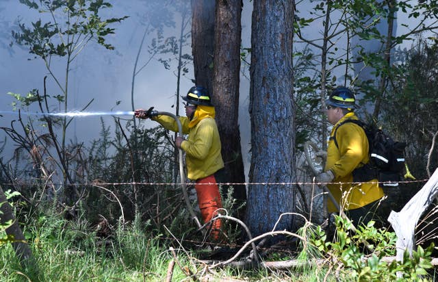 Hawaii firefighters on Maui battle a fire in Kula