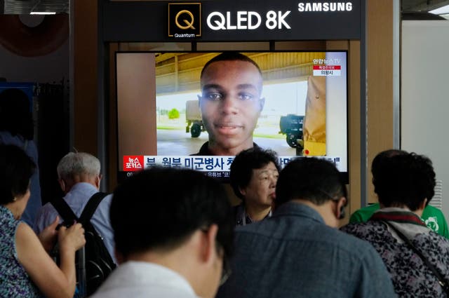 A TV screen shows a file image of American soldier Travis King during a news programme at Seoul railway station in South Korea