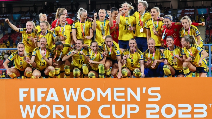 Sweden celebrate with their bronze medals after defeating Australia (Tertius Pickard/AP)