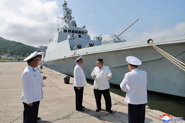 Kim Jong Un before a navy ship