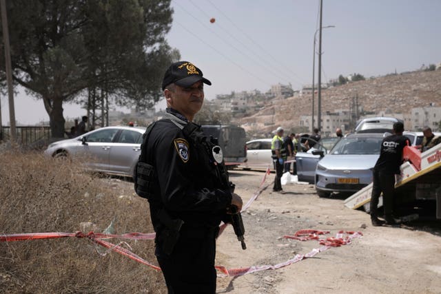 Soldiers guard the scene