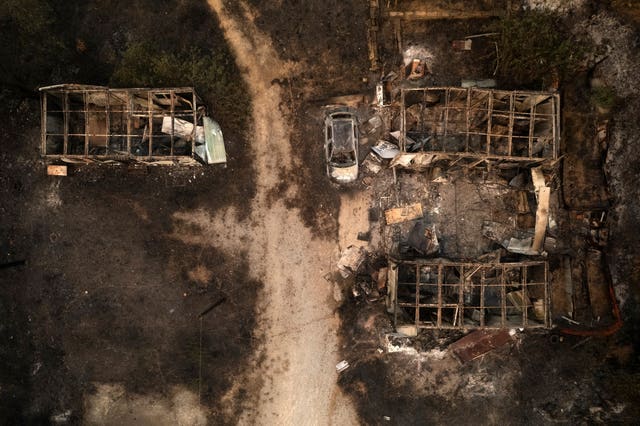 A burnt car and warehouses are seen from above in the village of Palagia, near Alexandroupolis