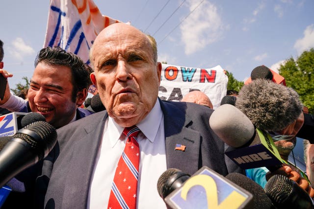 Rudy Giuliani speaks outside the Fulton County jail in Atlanta