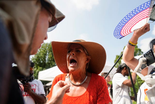 A Trump supporter shouts at the media outside the Fulton County Jail