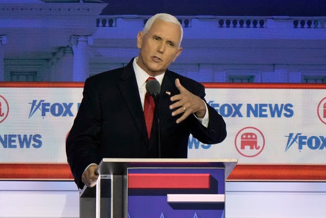 Republican presidential candidate and former vice president Mike Pence speaks during a Republican presidential primary debate in Milwaukee 
