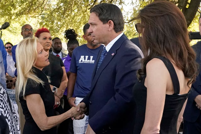 Jacksonville mayor Donna Deegan, left, greets Florida governor Ron DeSantis