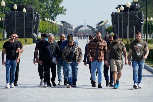 Colleagues of Dmitry Utkin, who oversaw the Wagner Group’s military operations, walk after a farewell ceremony for him at the Federal Military Memorial Cemetery in Mytishchy, outside Moscow, Russia 