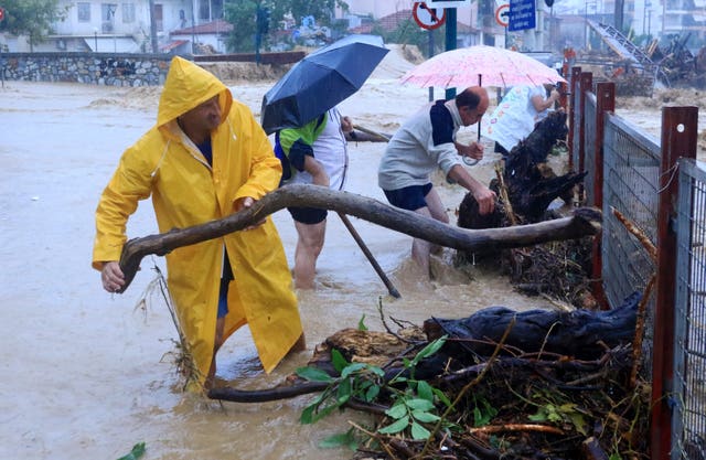 Residents remove debris in Volos, central Greece