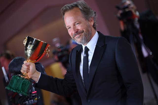Peter Sarsgaard with the best actor award after the closing ceremony for the 80th edition of the Venice Film Festival in Italy