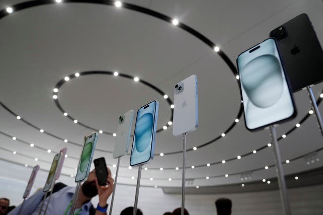 iPhone 15 and 15 Plus models are displayed during an announcement of new products on the Apple campus in Cupertino, California