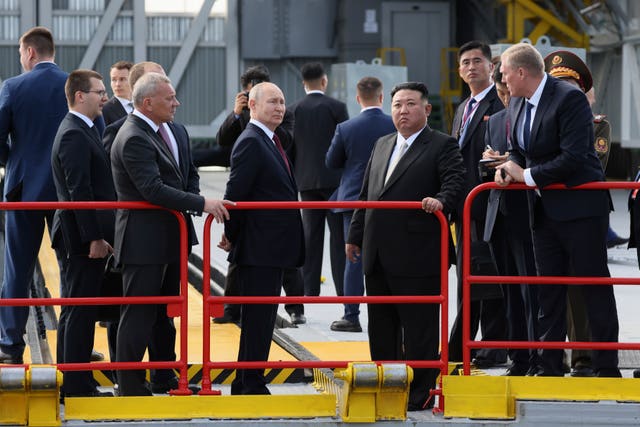 Mr Kim and Mr Putin meet among several dignitaries