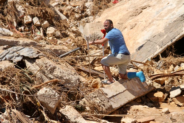 People look for survivors in Derna on Wednesday