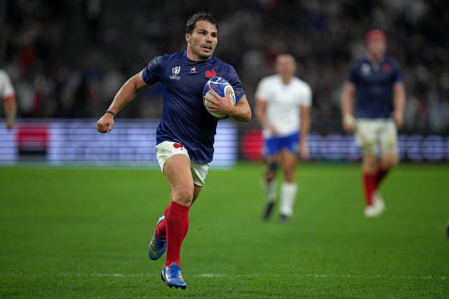 Antoine Dupont runs in for a try against Namibia 