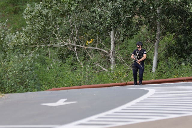 Police guard a road in Kosovo