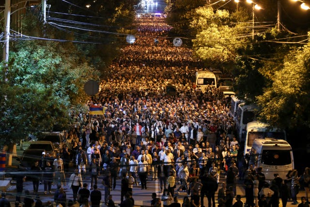 Demonstrators march during a protest against Prime Minister Nikol Pashinyan in Yerevan, Armenia