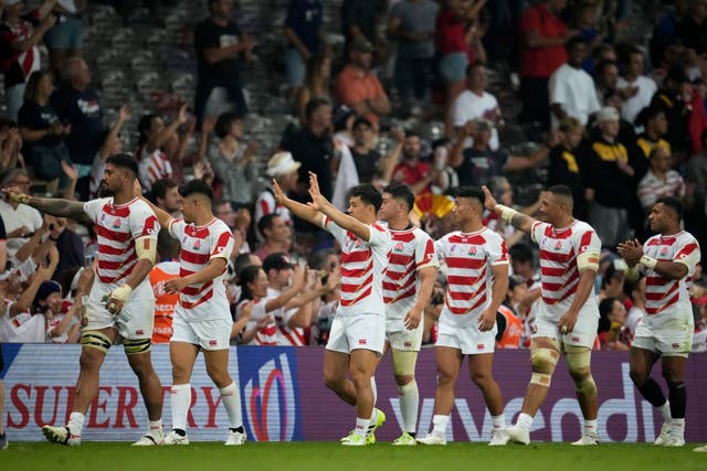 Japan’s players walk around the pitch after the end of the Rugby World Cup match against Samoa