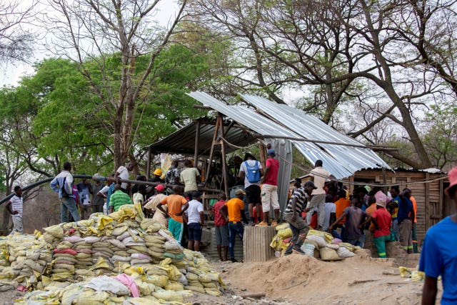 People gather around a collapsed mine in Chegutu 