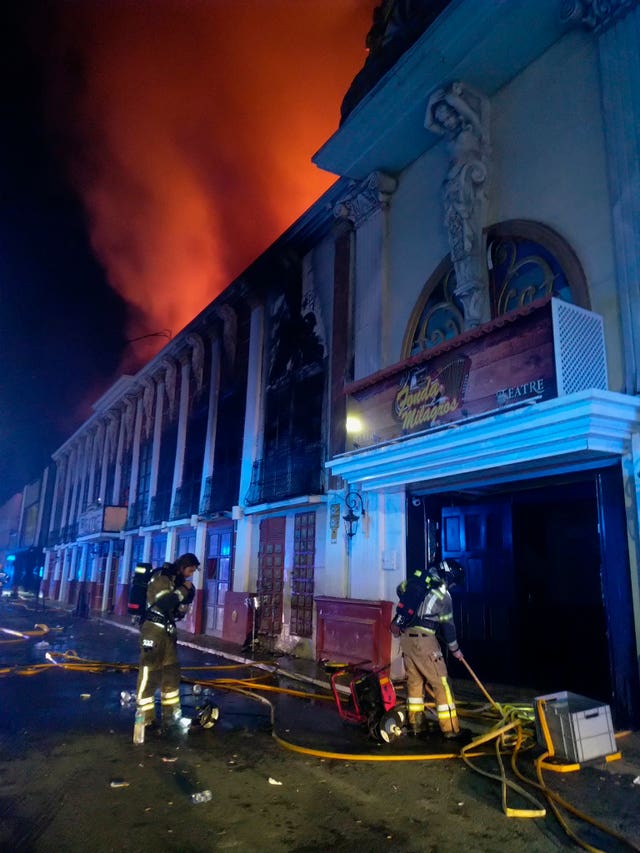 Firefighters work outside the nightclub 