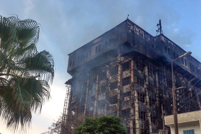 Smoke rises from the burning building following a fire