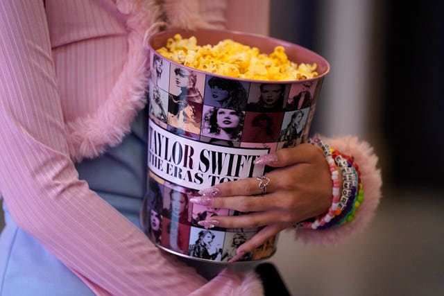 A fan attends the world premiere of Taylor Swift: The Eras Tour at AMC The Grove 14 in Los Angeles 