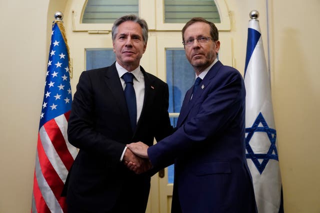 Antony Blinken shakes hands with Isaac Herzog