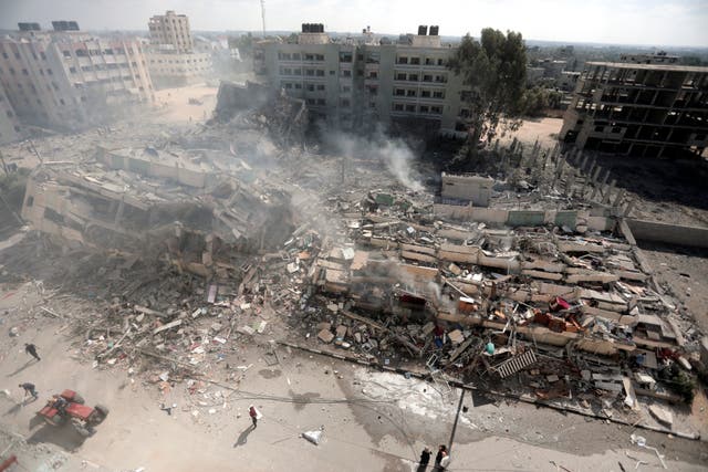 Smoke rises from destroyed buildings, following Israeli air strikes on Gaza City, central Gaza Strip