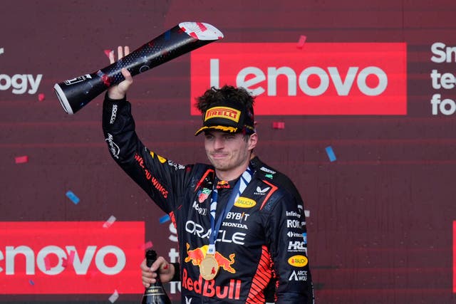 Red Bull driver Max Verstappen celebrates on the podium after winning the F1 US Grand Prix