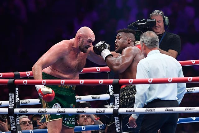 Tyson Fury, left, was put down in the third round (Yazeed Aldhawaihi/AP)