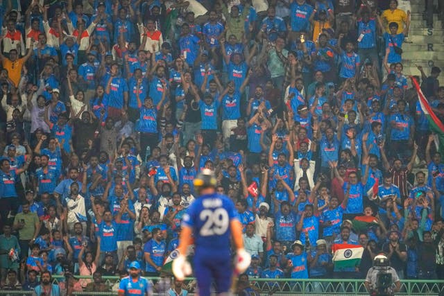 India fans celebrate the wicket of England’s Dawid Malan