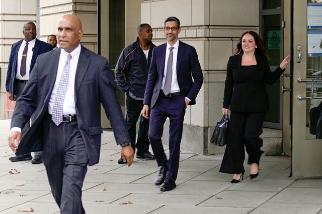 Google chief executive Sundar Pichai, centre, leaves the federal courthouse in Washington