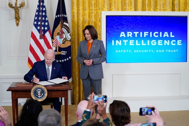 President Joe Biden signs an executive on artificial intelligence in the East Room of the White House in Washington