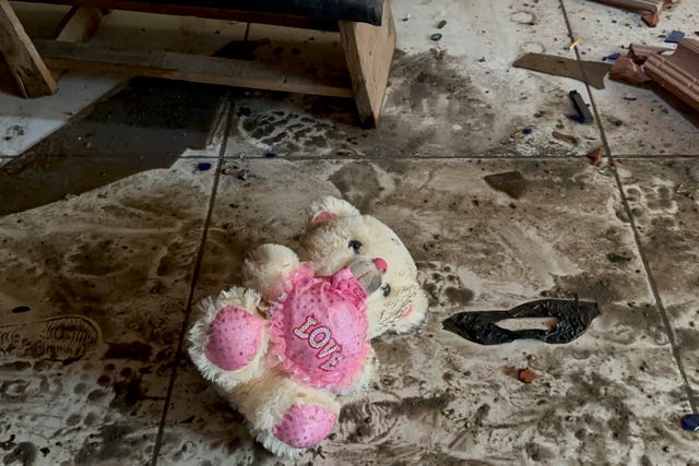 A teddy bear is seen on the floor following an Israeli air strike in Nusseirat refugee camp in Gaza Strip