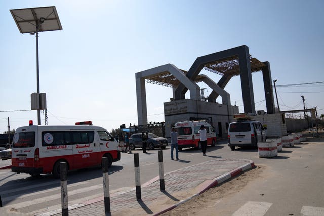 Ambulances with Palestinians wounded in the Israeli bombardment of the Gaza Strip arrive at the Rafah border crossing