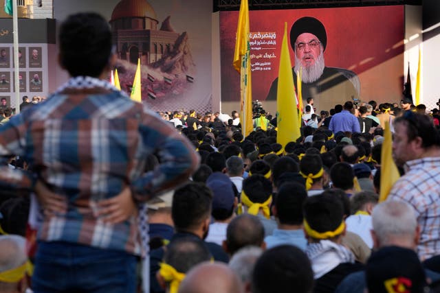 Supporters of the Hezbollah group listen to their leader Hassan Nasrallah