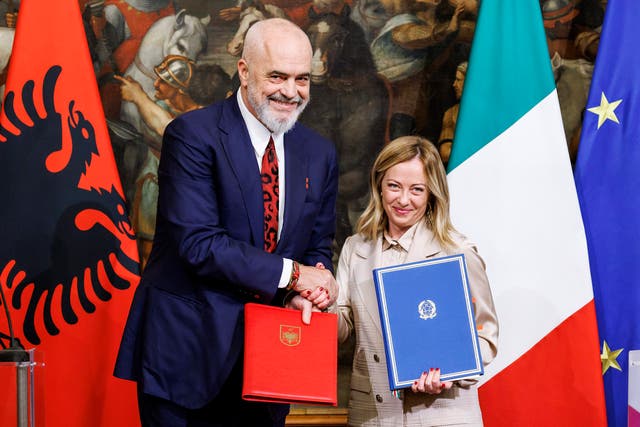 Giorgia Meloni (right) and Edi Rama shake hands after signing a memorandum of understanding on the scheme in November last year