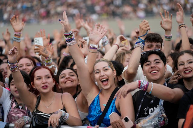 Fans wait for the start of the Taylor Swift: The Eras Tour concert in Buenos Aires, Argentina